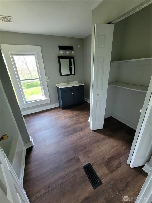 66 Barnett St Unit 64, Dayton, OH 45402 - bathroom with vanity, wood finished floors, and baseboards