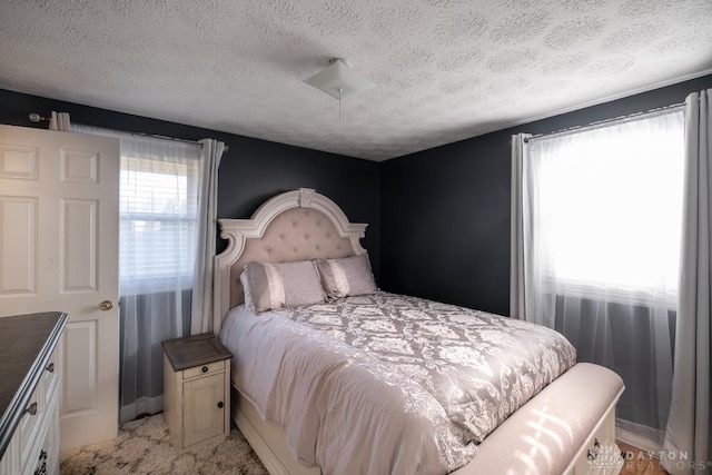 bedroom featuring a textured ceiling