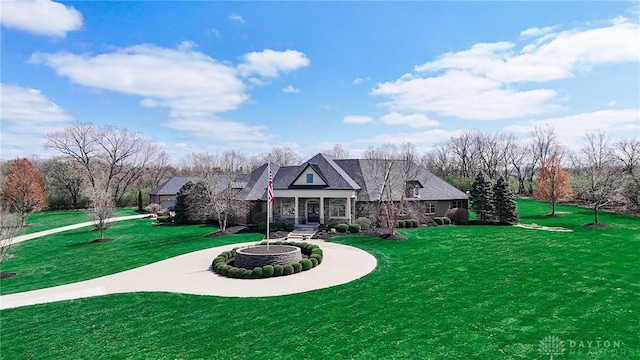 7177 Paul Ln, Liberty Twp, OH 45044 - view of front facade with a front lawn and stone siding
