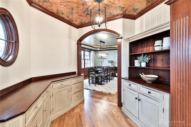 7177 Paul Ln, Liberty Twp, OH 45044 - bar with an inviting chandelier, light wood-style floors, and crown molding