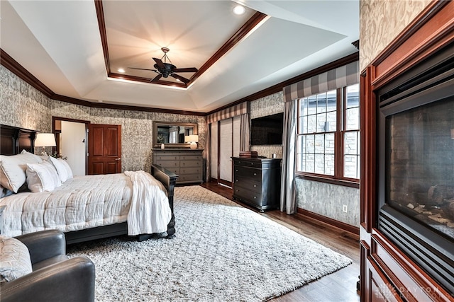 7177 Paul Ln, Liberty Twp, OH 45044 - bedroom featuring wood finished floors, crown molding, a tray ceiling, and wallpapered walls