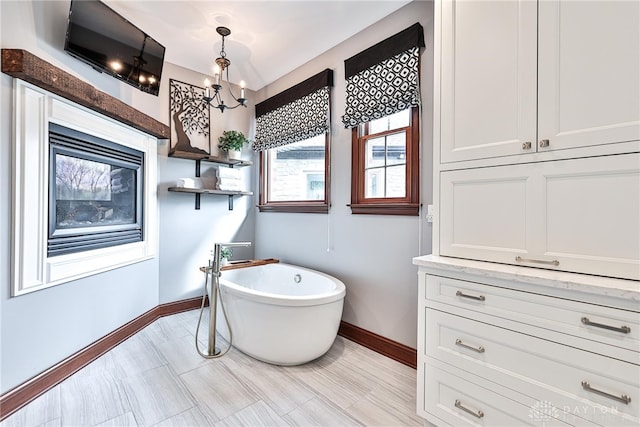 7177 Paul Ln, Liberty Twp, OH 45044 - bathroom with baseboards and a soaking tub