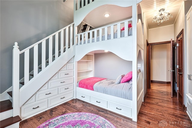 7177 Paul Ln, Liberty Twp, OH 45044 - bedroom featuring dark wood-type flooring, a notable chandelier, and baseboards