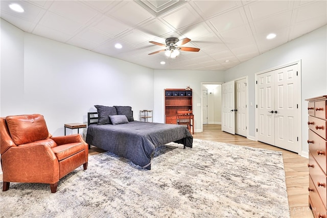 7177 Paul Ln, Liberty Twp, OH 45044 - bedroom with baseboards, recessed lighting, two closets, and light wood-style flooring