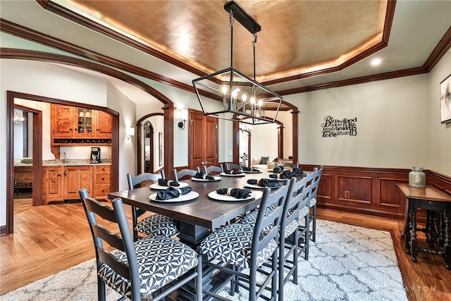 7177 Paul Ln, Liberty Twp, OH 45044 - dining room with light wood finished floors, wainscoting, a raised ceiling, and a chandelier