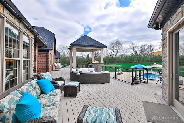 7177 Paul Ln, Liberty Twp, OH 45044 - wooden deck with a fenced in pool, an outdoor hangout area, and a gazebo