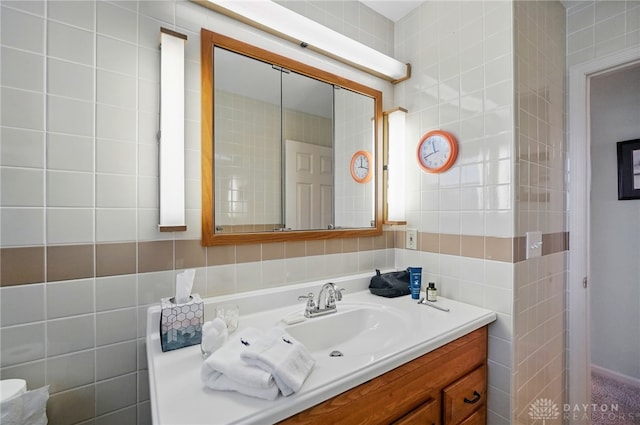 bathroom with tile walls and vanity