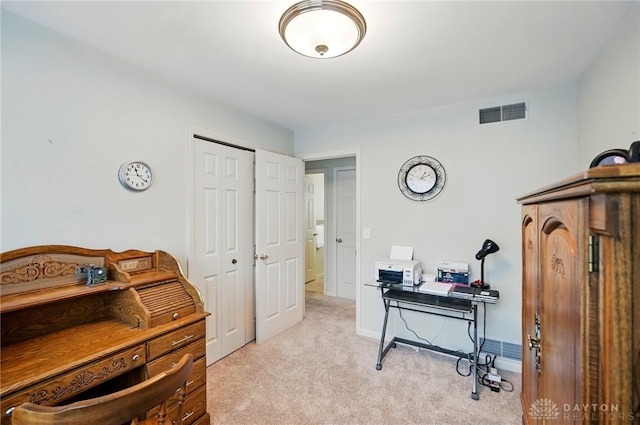 carpeted home office with visible vents