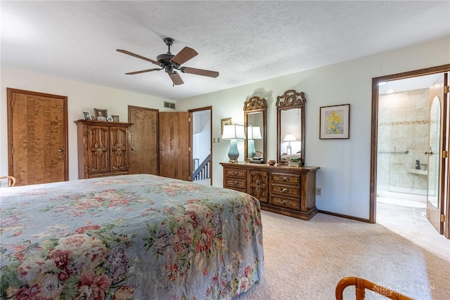 9168 Woodstream Ln, Washington Twp, OH 45458 - bedroom with light colored carpet, ensuite bath, ceiling fan, and two closets