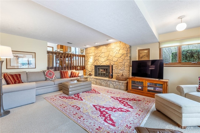9168 Woodstream Ln, Washington Twp, OH 45458 - carpeted living area featuring a textured ceiling and a stone fireplace