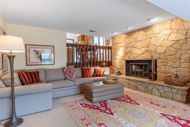 9168 Woodstream Ln, Washington Twp, OH 45458 - living area featuring carpet floors, a textured ceiling, and a stone fireplace
