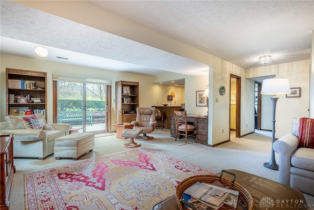9168 Woodstream Ln, Washington Twp, OH 45458 - living area featuring light colored carpet and a textured ceiling