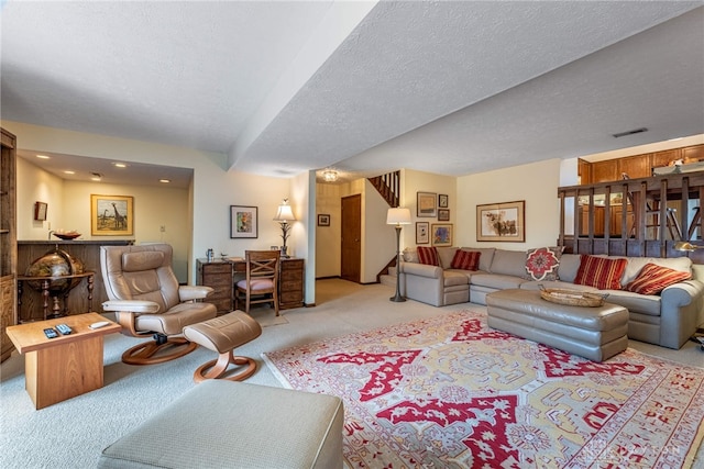 9168 Woodstream Ln, Washington Twp, OH 45458 - living area with light colored carpet, stairs, a textured ceiling, and recessed lighting