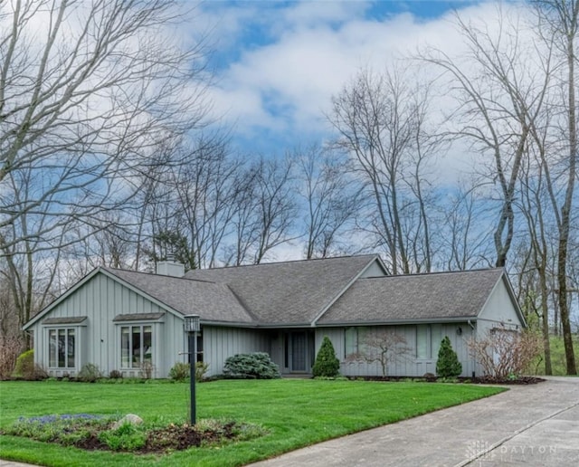 9168 Woodstream Ln, Washington Twp, OH 45458 - view of front facade with a front lawn, board and batten siding, and a shingled roof