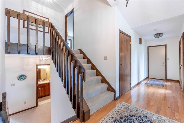 9168 Woodstream Ln, Washington Twp, OH 45458 - entrance foyer featuring stairway and light wood-style floors