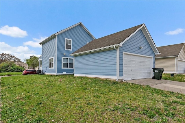 view of home's exterior featuring a garage, central AC, a yard, and concrete driveway