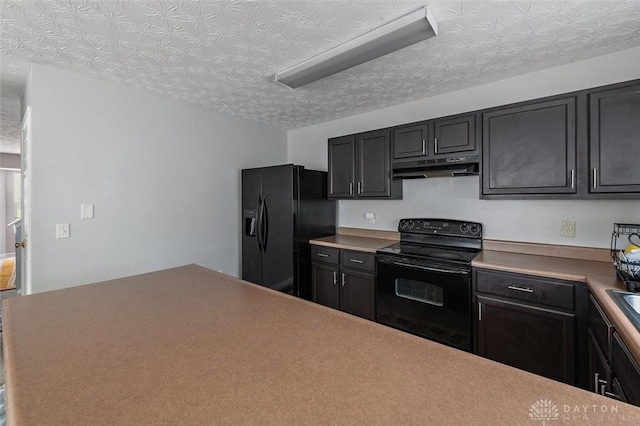 kitchen with black appliances, a textured ceiling, and under cabinet range hood