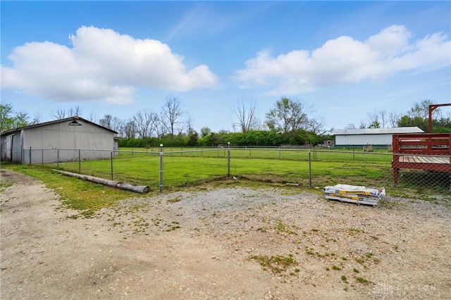 view of yard with a rural view and fence