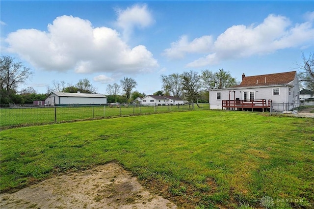 view of yard with a wooden deck and a fenced backyard