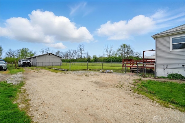 view of yard with a wooden deck and fence