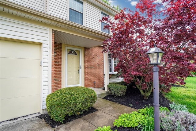 8500 Crestmont Dr, West Chester, OH 45069 - property entrance with brick siding and a garage