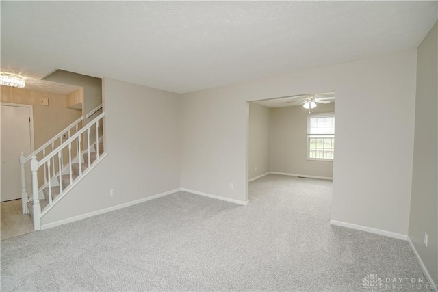 8500 Crestmont Dr, West Chester, OH 45069 - unfurnished room featuring stairway, carpet floors, and ceiling fan