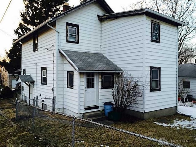 14 N Freeman St, Springfield, OH 45503 - back of property featuring a shingled roof, entry steps, and fence private yard