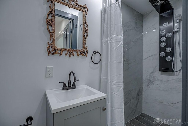 bathroom with vanity and a shower with shower curtain