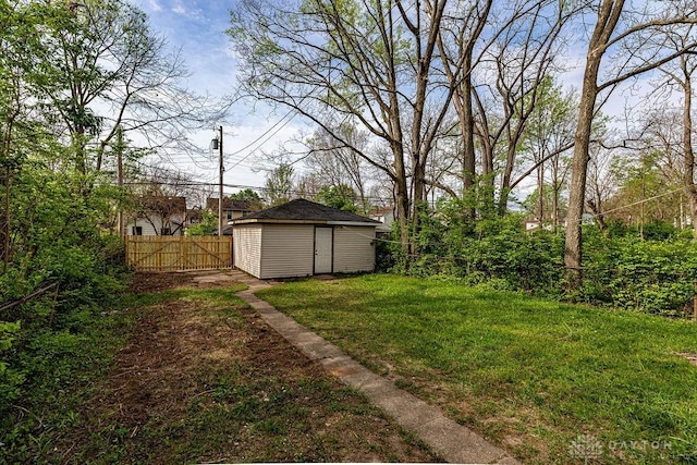 view of yard featuring an outdoor structure and a fenced backyard