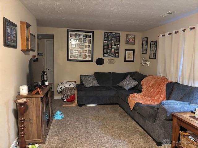carpeted living room with a textured ceiling and visible vents