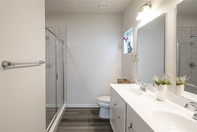 full bathroom with a stall shower, a sink, and visible vents