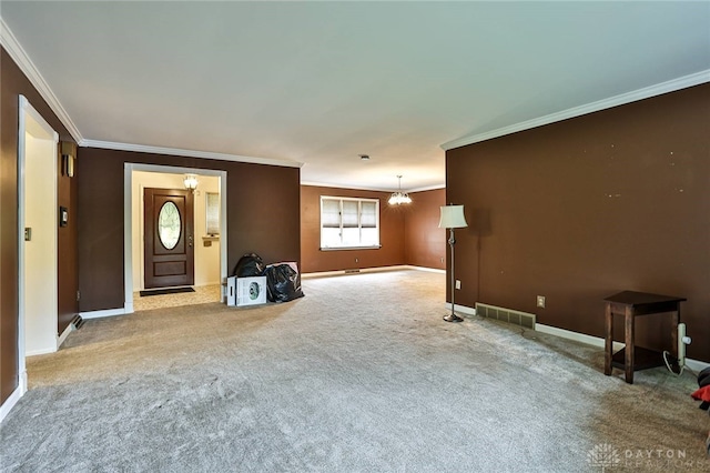 unfurnished living room featuring crown molding, carpet flooring, and baseboards