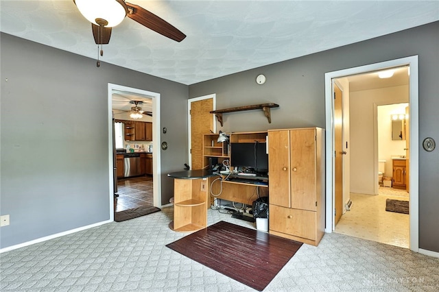 interior space featuring carpet floors, baseboards, and a ceiling fan