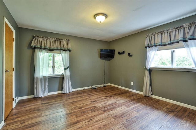 10699 Hamilton Ave, Cincinnati, OH 45231 - empty room featuring hardwood / wood-style floors and baseboards