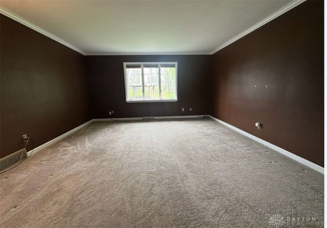 10699 Hamilton Ave, Cincinnati, OH 45231 - carpeted empty room featuring baseboards and ornamental molding