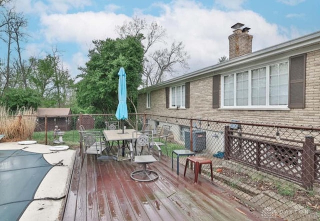 10699 Hamilton Ave, Cincinnati, OH 45231 - wooden deck featuring outdoor dining area
