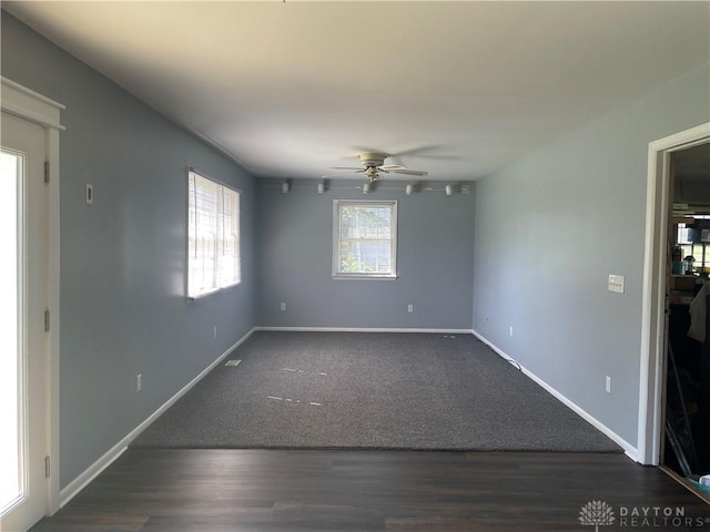 928 Shady Ln, Beavercreek, OH 45434 - carpeted empty room with a ceiling fan, baseboards, and wood finished floors