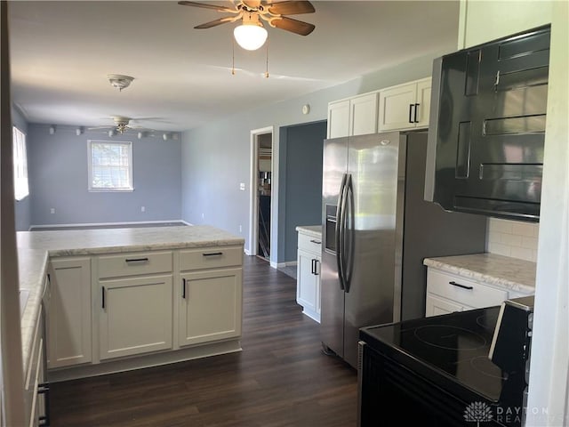 928 Shady Ln, Beavercreek, OH 45434 - kitchen with a ceiling fan, black / electric stove, white cabinetry, dark wood-type flooring, and backsplash