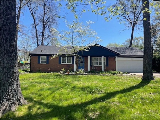 928 Shady Ln, Beavercreek, OH 45434 - ranch-style home with brick siding, a garage, a front yard, and driveway