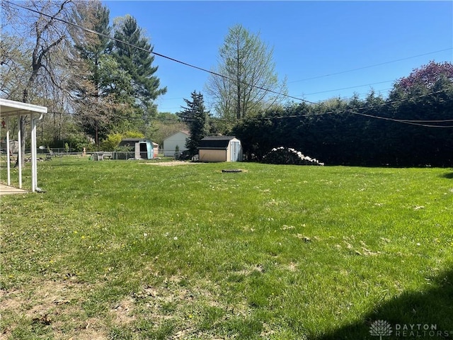 928 Shady Ln, Beavercreek, OH 45434 - view of yard featuring a storage unit and an outbuilding