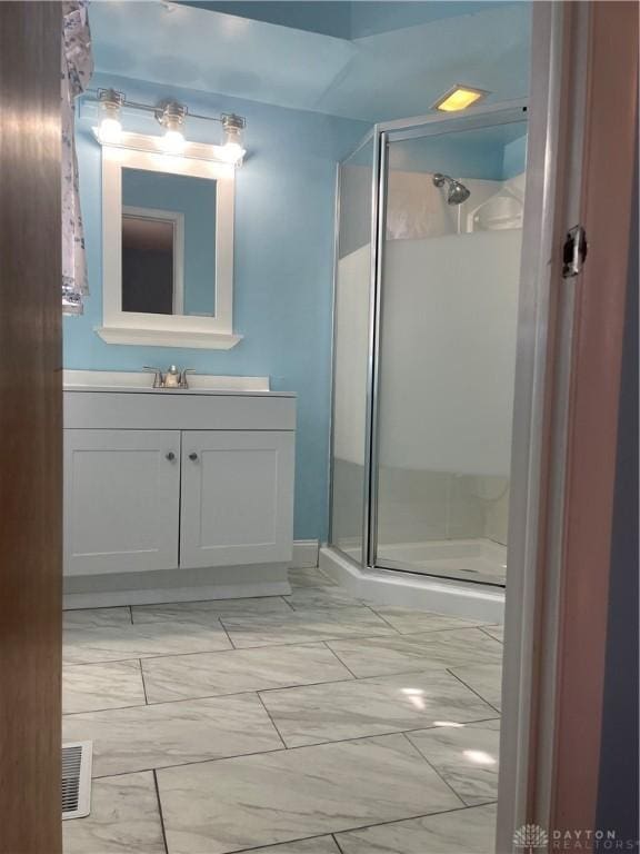 928 Shady Ln, Beavercreek, OH 45434 - full bathroom with marble finish flooring, a shower stall, and vanity