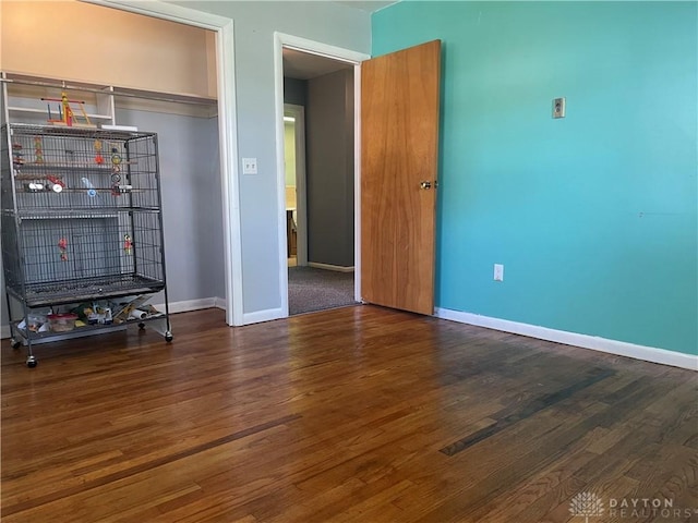 928 Shady Ln, Beavercreek, OH 45434 - unfurnished bedroom with wood finished floors and baseboards