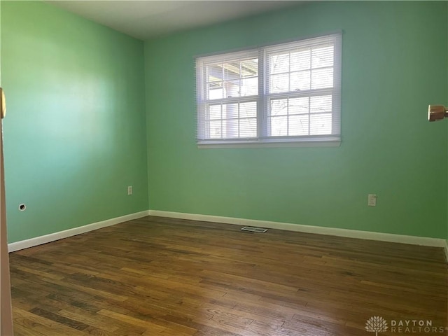 928 Shady Ln, Beavercreek, OH 45434 - unfurnished room with dark wood-style floors and baseboards