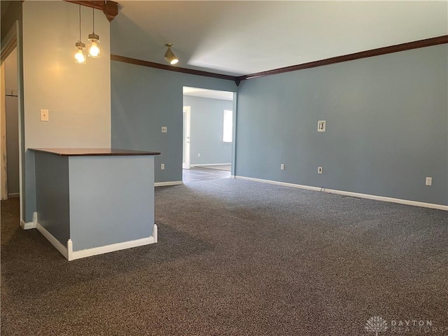 928 Shady Ln, Beavercreek, OH 45434 - empty room featuring crown molding, baseboards, and dark colored carpet