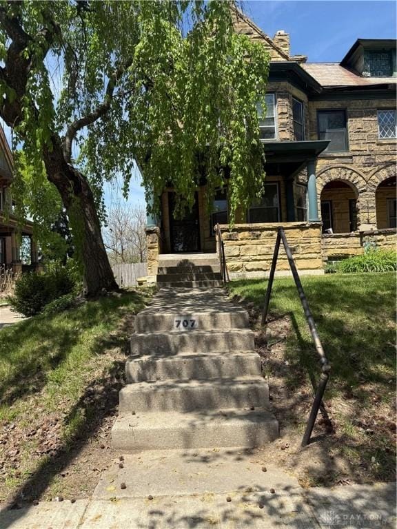 view of front of home with stone siding