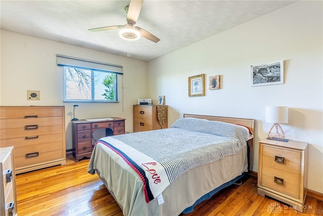 bedroom featuring ceiling fan and light wood-style flooring