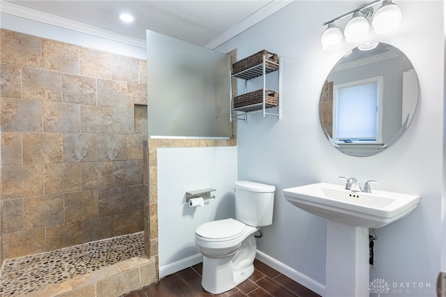 bathroom featuring a walk in shower, ornamental molding, toilet, and wood finished floors