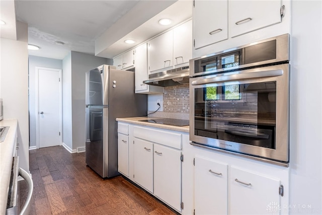kitchen featuring decorative backsplash, light countertops, white cabinetry, under cabinet range hood, and stainless steel appliances