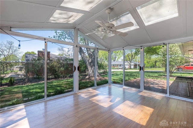 unfurnished sunroom with a ceiling fan