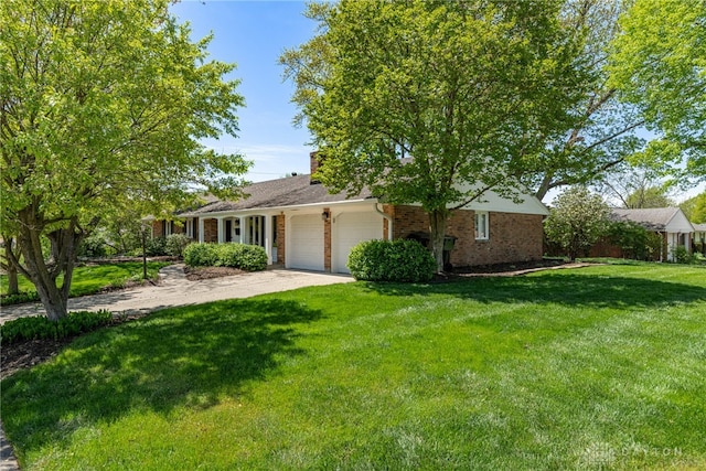 single story home with concrete driveway, brick siding, a front yard, and a garage